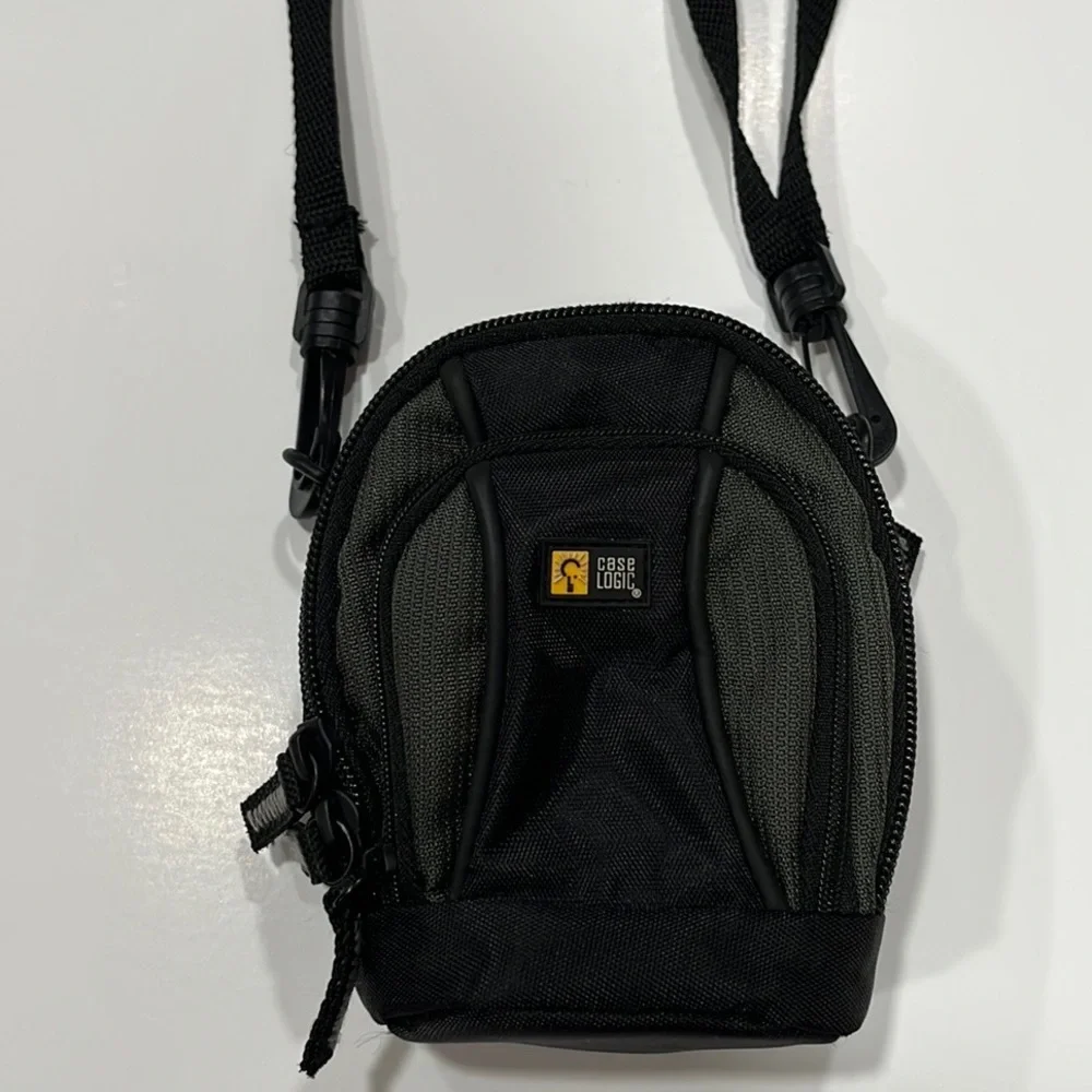 Case Logic Small black/dark green camera case with shoulder strap.